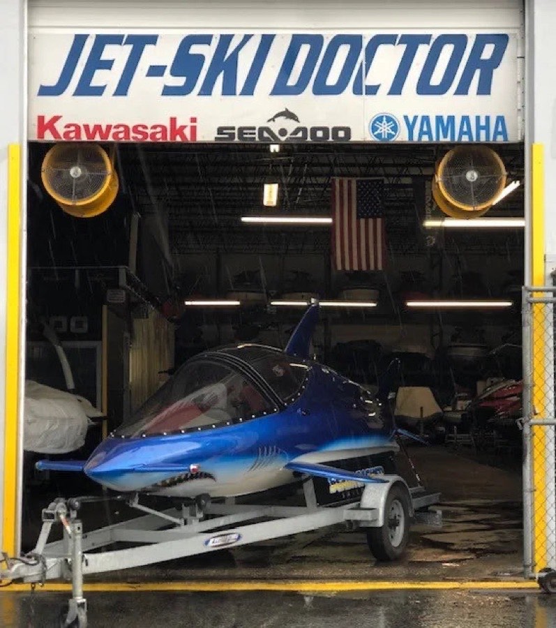 The Jet-Ski Doctor shop door with a custom shark jet ski