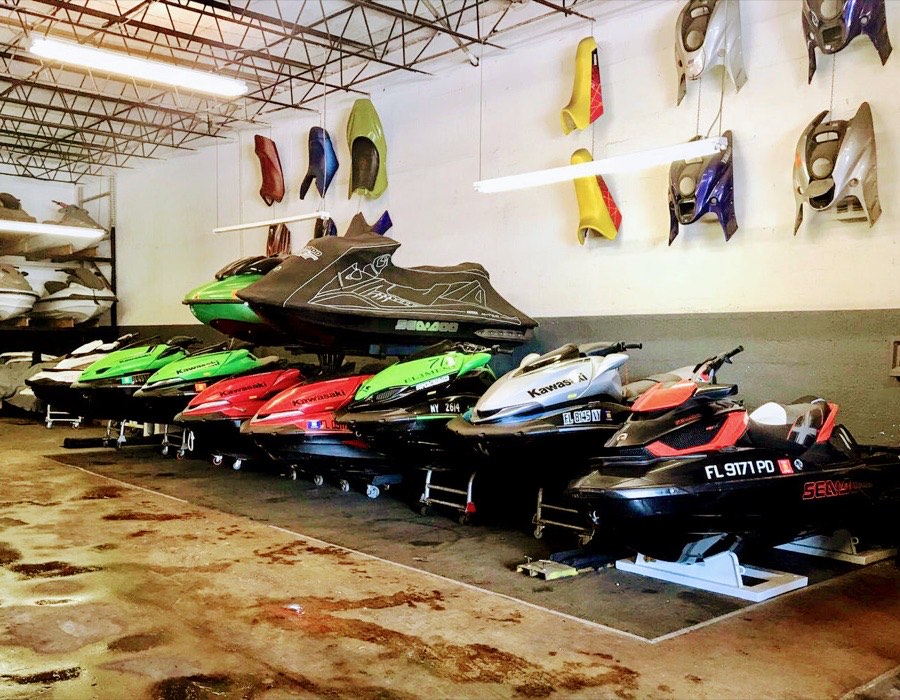 A row of jet skis lined up in the shop