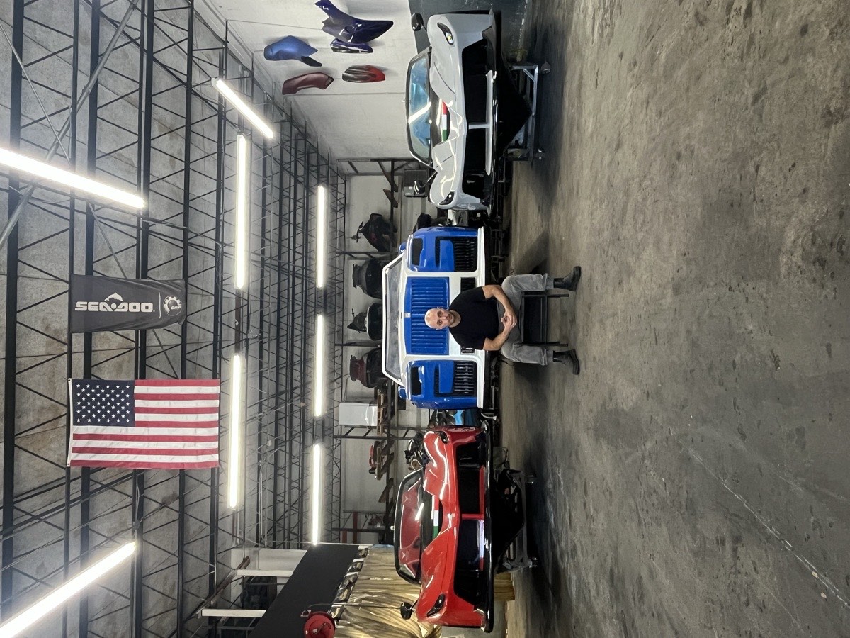 Inside The Jet-Ski Doctor shop — jet cars and skis under the Sea-Doo flag